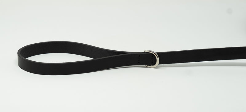 Black leather belt with a silver buckle on a white background