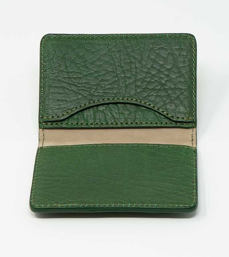 Green leather wallet on a white background