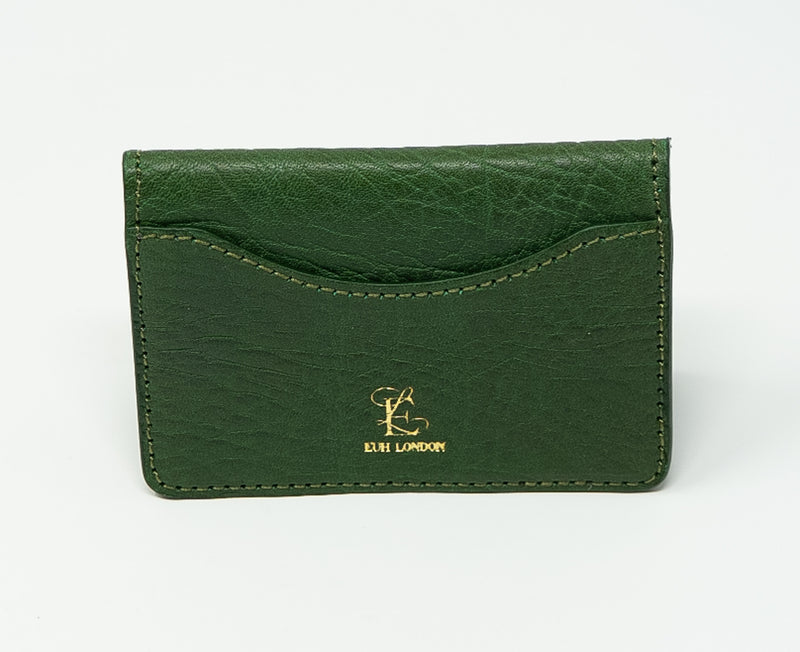 Green leather cardholder with gold logo on a white background