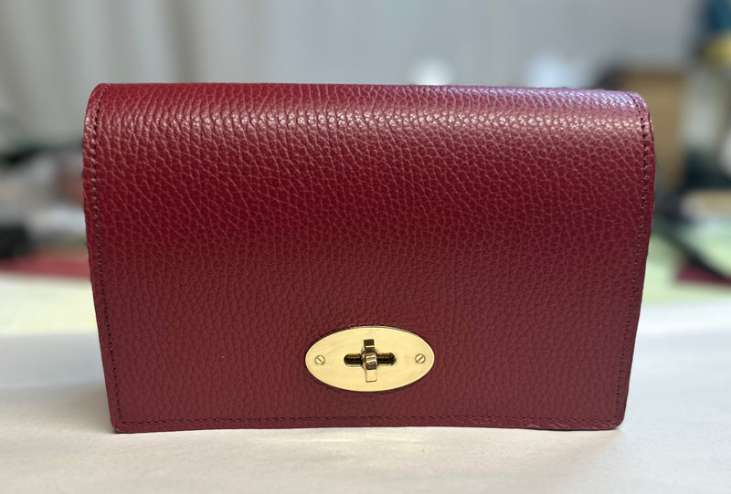 The Luna bag in burgundy with gold twist lock