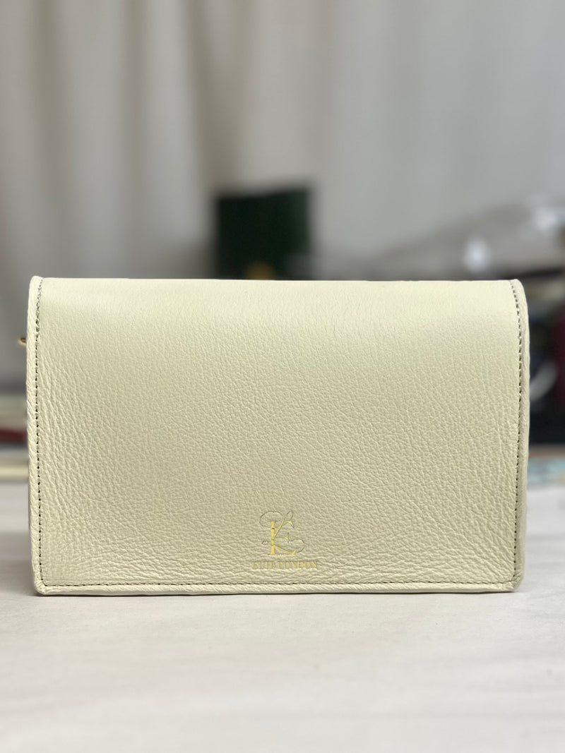 the luna bag with Euh London brand on back of cream leather