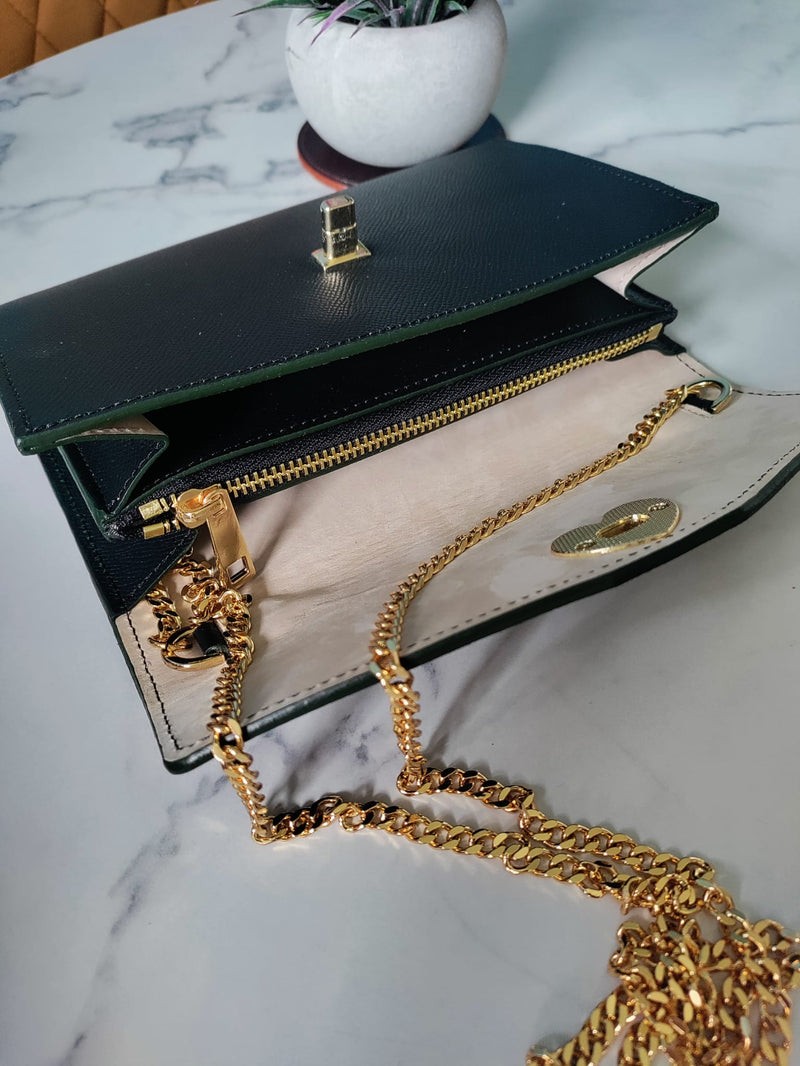 saffiano leather clutch pouch inside view showing internal gold zipper compartment