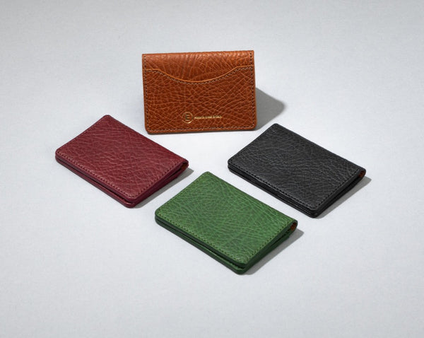 burgundy, green, black and brown card wallet.