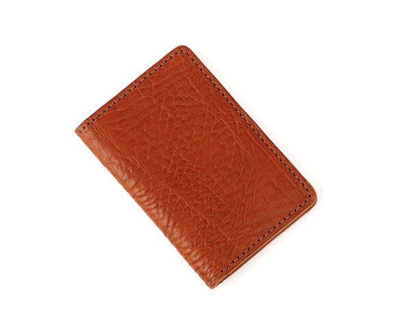 folded brown leather card wallet.