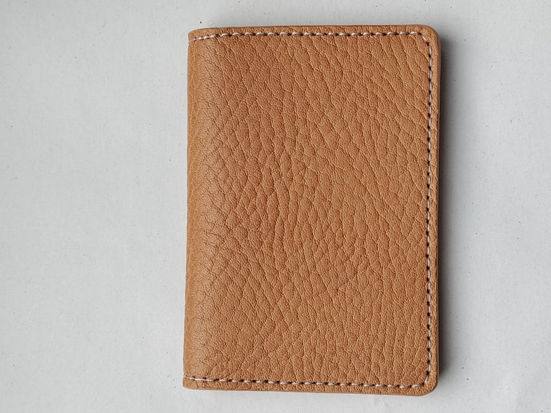 folded natural leather card wallet.